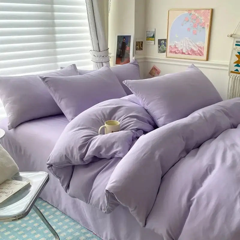 Duvet cover bedding set in lavender with matching pillows by Decorbites on a cozy bed in a bright bedroom on Tampa Home & Garden Store