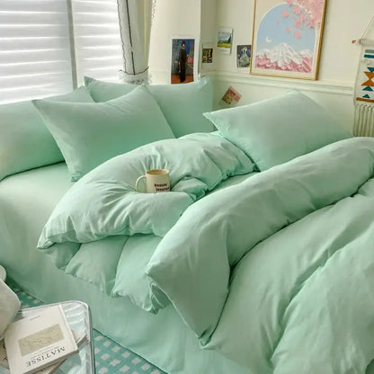 Duvet cover bedding set in mint green with multiple pillows on bed on Tampa Home & Garden Store