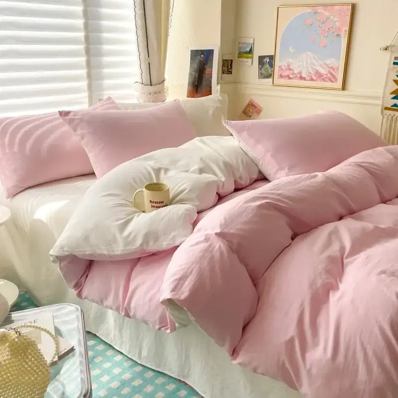 Decorbites duvet cover set in pink and white on bed with pink pillows in a cozy bedroom on Tampa Home & Garden Store