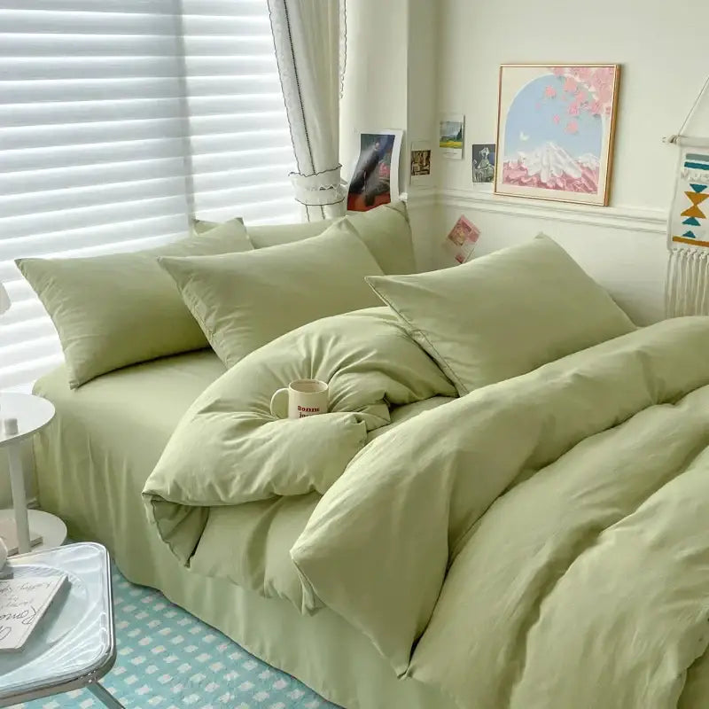 Decorbites pale green duvet cover bedding set with matching pillows in a sunlit cozy bedroom on Tampa Home & Garden Store