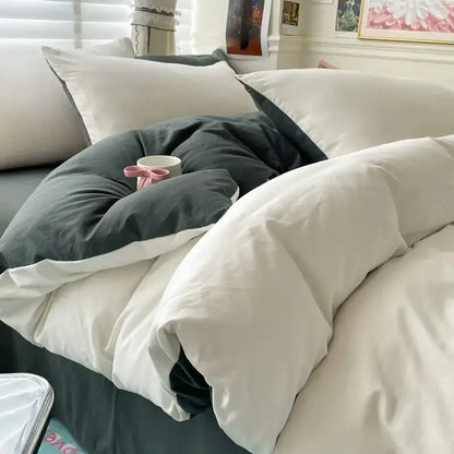Decorbites duvet cover set in white and dark gray on bed with white pillows on Tampa Home & Garden Store