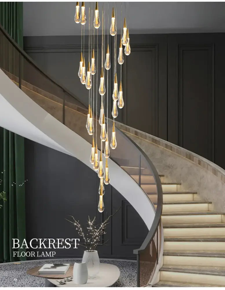 Gold teardrop chandelier by Decorbites with clear glass droplets, cascading pendant lights on Tampa Home & Garden Store
