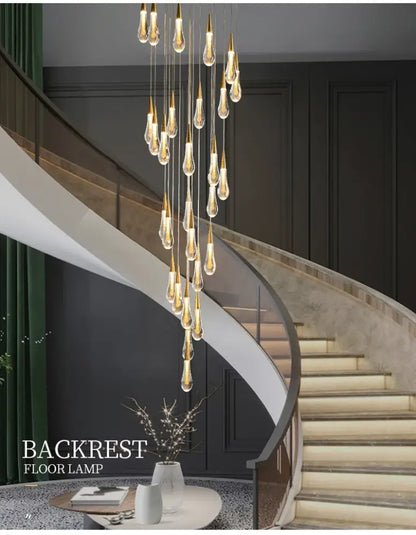 Gold teardrop chandelier by Decorbites with clear glass droplets, cascading pendant lights on Tampa Home & Garden Store