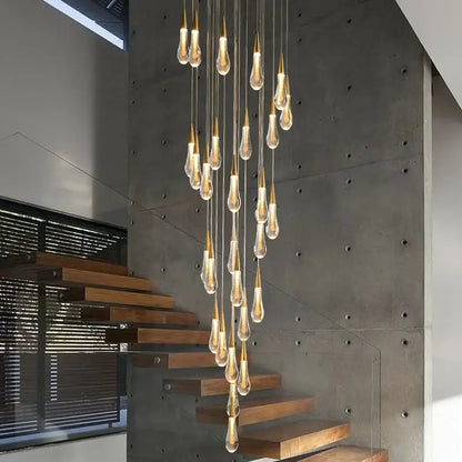 Gold teardrop chandelier with cascading glass drops; warm glow, Decorbites pendant lighting on Tampa Home & Garden Store