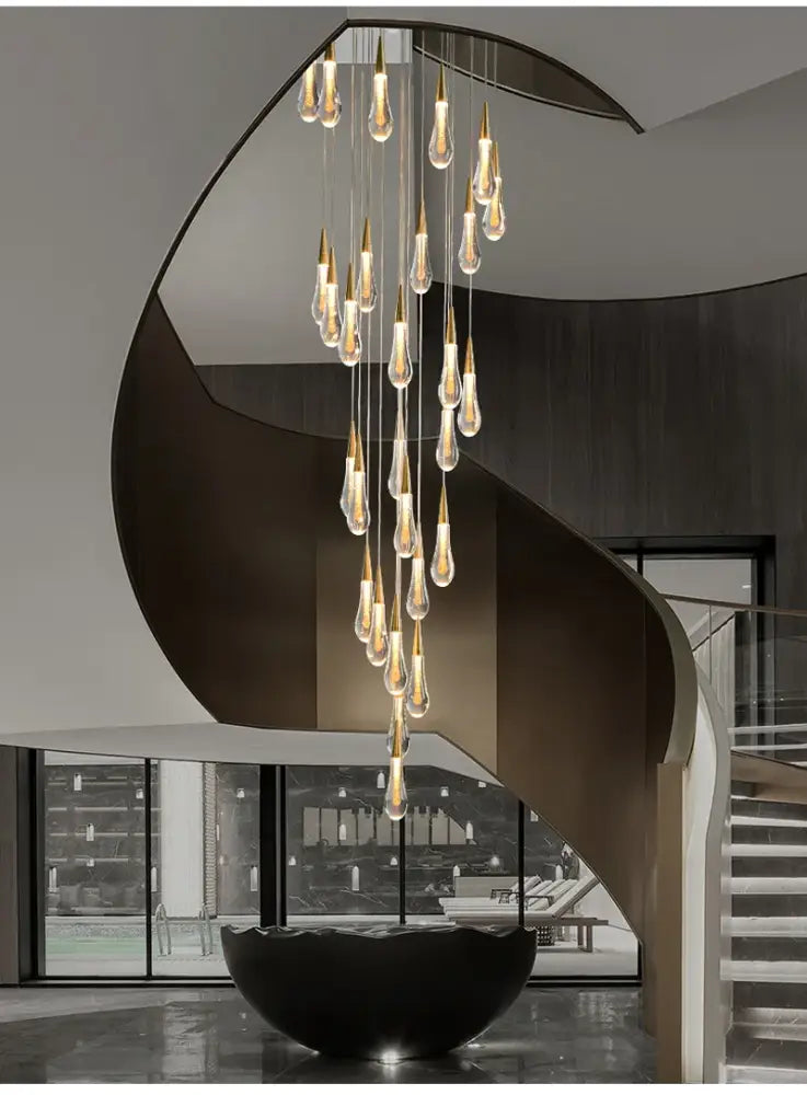 Gold Teardrop Chandelier with cascading glass teardrops and gold accents by Decorbites on Tampa Home & Garden Store