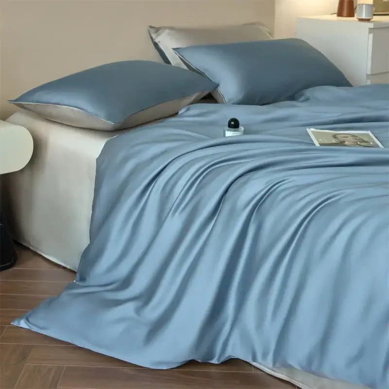 Duvet cover set Decorbites blue lyocell silk with matching pillowcases on bed on Tampa Home & Garden Store