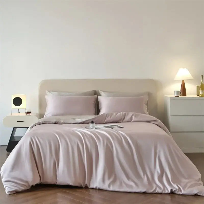 Beige lyocell silk duvet cover set by Decorbites with 2 pillow shams on a bed on Tampa Home & Garden Store