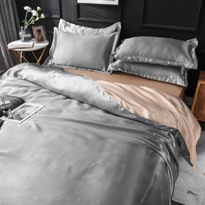 Silk duvet cover set by Decorbites in blush pink with silver-grey sheets on bed on Tampa Home & Garden Store