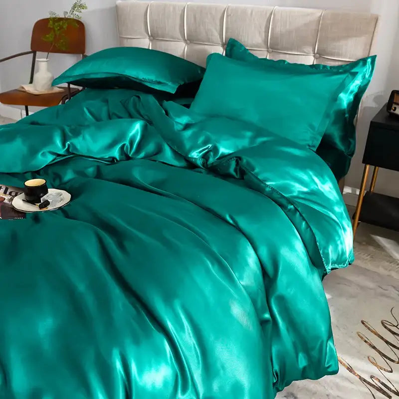 Teal satin duvet cover set with matching pillowcases by Decorbites on bed on Tampa Home & Garden Store