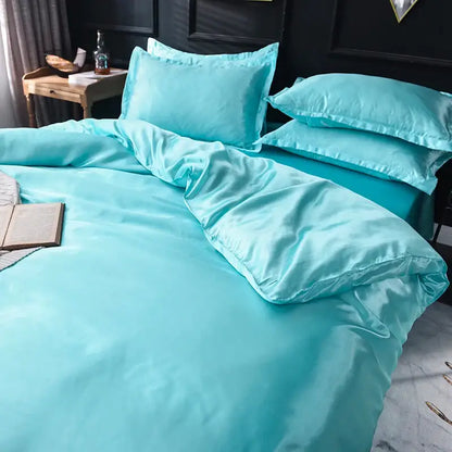 Silk duvet cover set in turquoise with matching pillowcases on a bed on Tampa Home & Garden Store