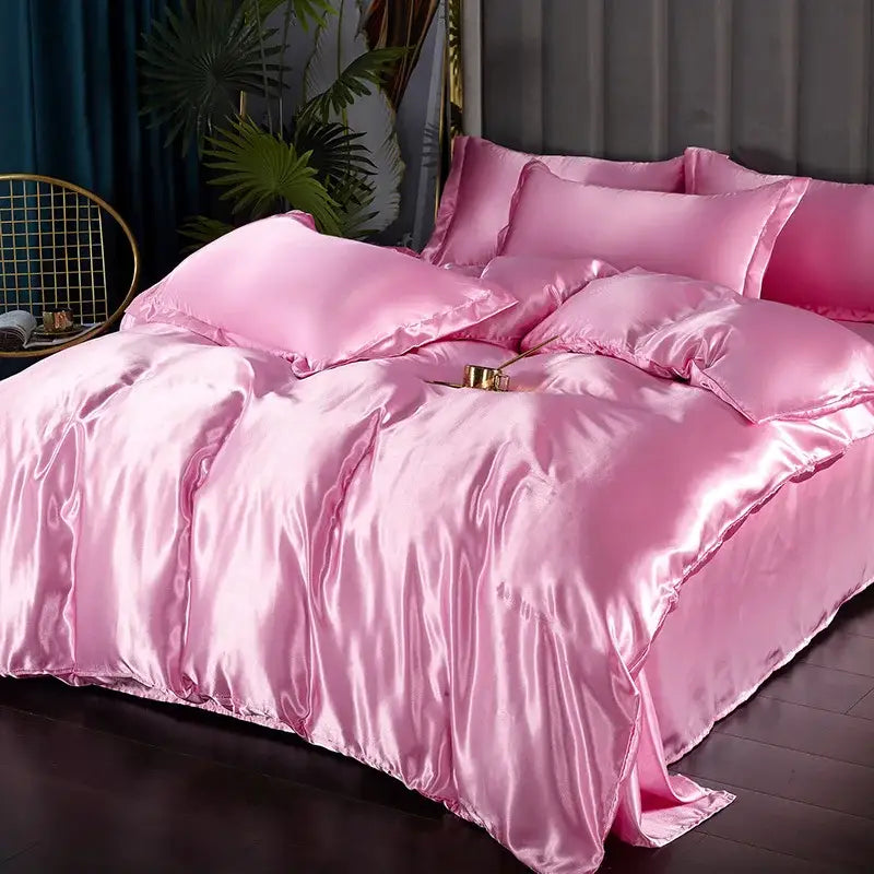 Decorbites pink satin duvet cover set with matching pillow shams on a bed, satin sheen on Tampa Home & Garden Store