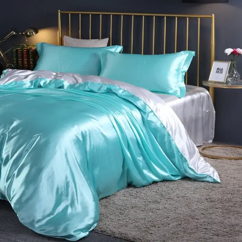 Decorbites satin bedding duvet cover set turquoise with matching pillow shams on bed on Tampa Home & Garden Store