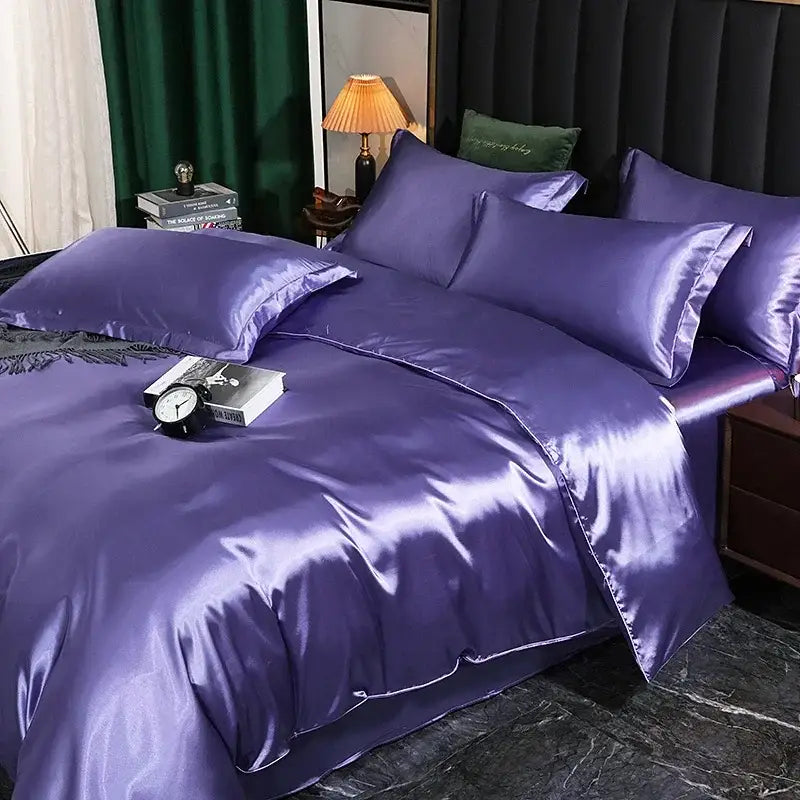 Purple satin duvet cover set with matching pillowcases on the bed on Tampa Home & Garden Store