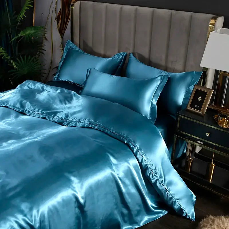 Satin silk duvet cover set Decorbites teal with stitched edges on a bed on Tampa Home & Garden Store