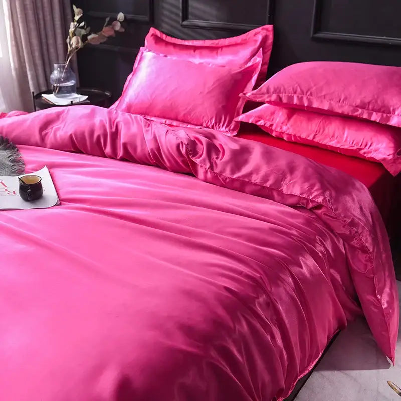 Pink satin silk duvet cover set with stitched edges by Decorbites on bed on Tampa Home & Garden Store