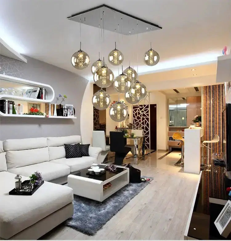 Chandelier modern loft dark amber glass spiral pendant with globe lights over a living area on Tampa Home & Garden Store