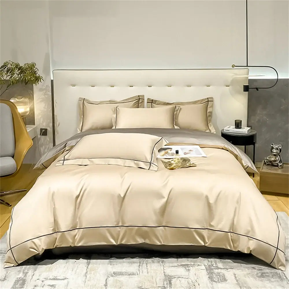 Decorbites egyptian cotton duvet cover set in champagne beige with navy piping on a plush bed on Tampa Home & Garden Store