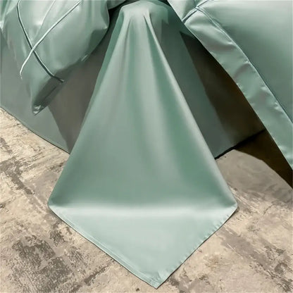 Decorbites green egyptian cotton duvet cover set draped over bed with satin finish on concrete on Tampa Home & Garden Store