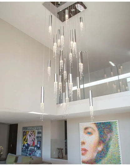 Chrome cascading chandelier with cylinders and crystal drops by Decorbites in a living room on Tampa Home & Garden Store