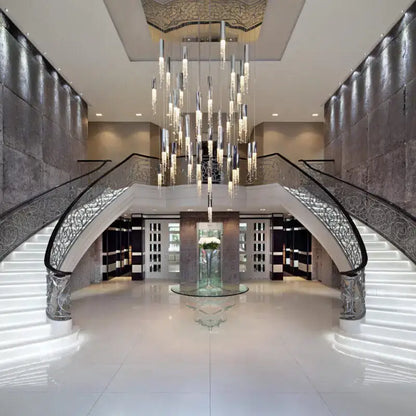 Chrome Cascading Chandelier with crystal prisms over a grand foyer staircase by Decorbites on Tampa Home & Garden Store