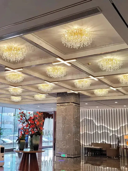Luxury gold branch crystal chandelier with cascading crystal drops in hotel lobby on Tampa Home & Garden Store