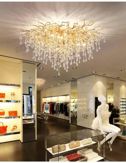 Chandelier Decorbites luxury gold branch crystal pendant light in showroom on Tampa Home & Garden Store