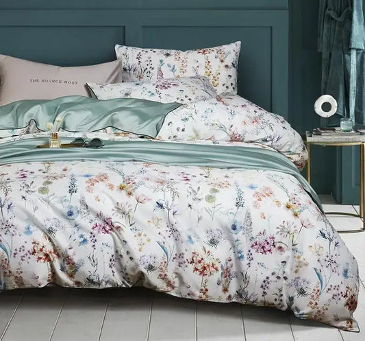Decorbites Floral White Cotton Duvet Cover set with colorful botanical print and teal accents on bed on Tampa Home & Garden Store