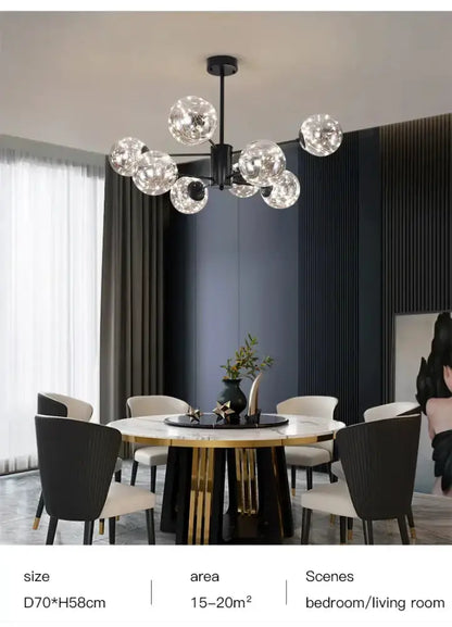 Modern black glass ball chandelier with clear globes over a round marble dining table on Tampa Home & Garden Store