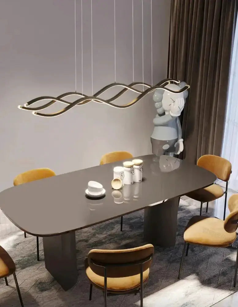 Chandelier: modern white wavy LED pendant by Decorbites over dining table with yellow chairs on Tampa Home & Garden Store