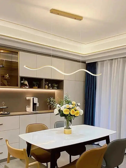 Chandelier: modern white wavy LED pendant light by Decorbites over a dining table on Tampa Home & Garden Store