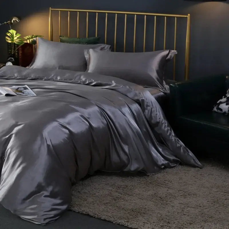 Champagne satin bedding set duvet cover by Decorbites on a brass bed with gray satin pillowcases on Tampa Home & Garden Store