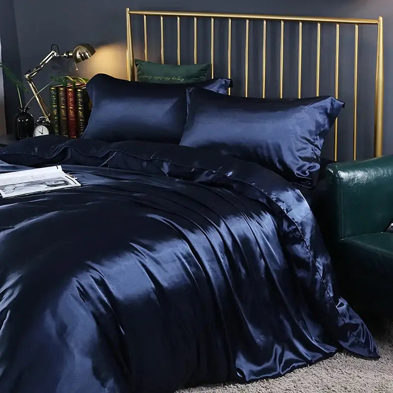 Satin bedding set by Decorbites in navy blue with a gold metal bed frame on Tampa Home & Garden Store