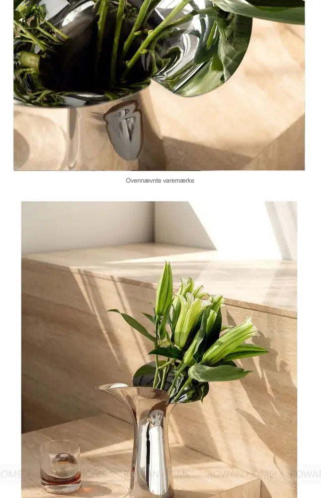 Silver stainless steel vase by Decorbites with green stems; reflective finish on beige shelf on Tampa Home & Garden Store