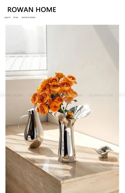 Silver stainless steel vase with orange roses, Decorbites, modern reflective decor on marble on Tampa Home & Garden Store