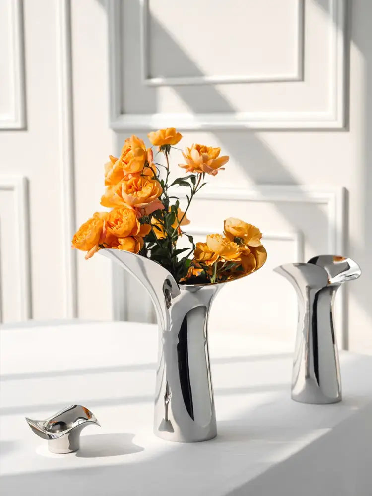 Silver stainless steel vase set with orange roses by Decorbites on Tampa Home & Garden Store