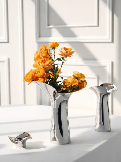 Silver stainless steel vase set with orange roses by Decorbites on Tampa Home & Garden Store