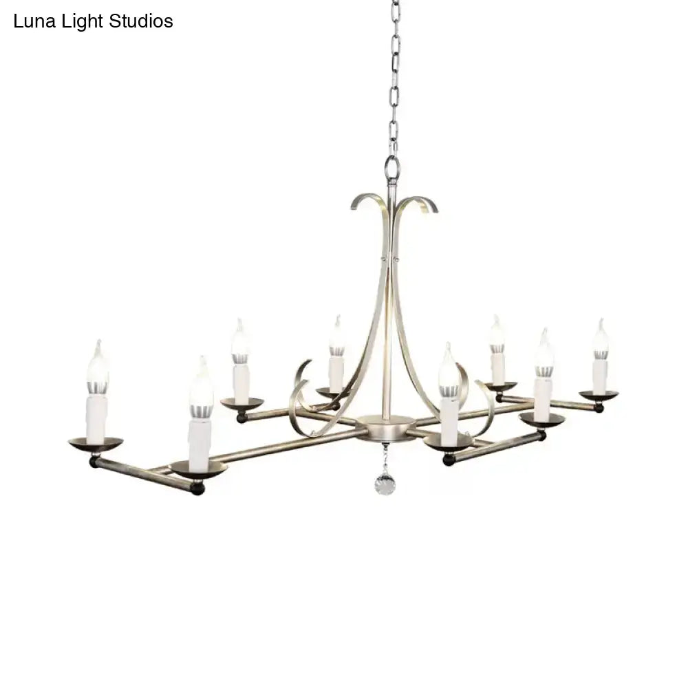 Antique brass candle chandelier with curved arms and candle-style lights on chain on Tampa Home & Garden Store