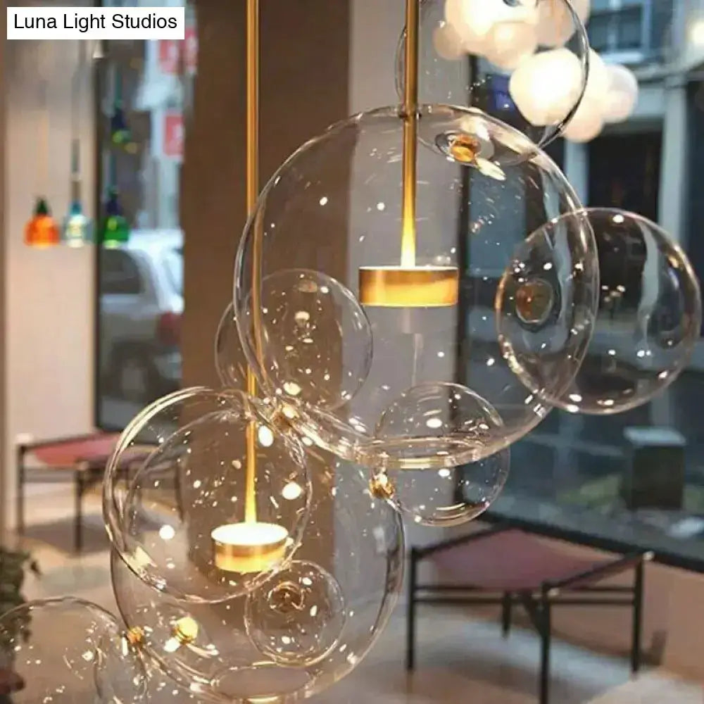 Modern brass bubble cluster pendant light with clear glass globes Decorbites on Tampa Home & Garden Store