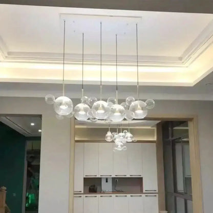 Modern brass bubble cluster pendant light by Decorbites, clear glass spheres for dining room on Tampa Home & Garden Store
