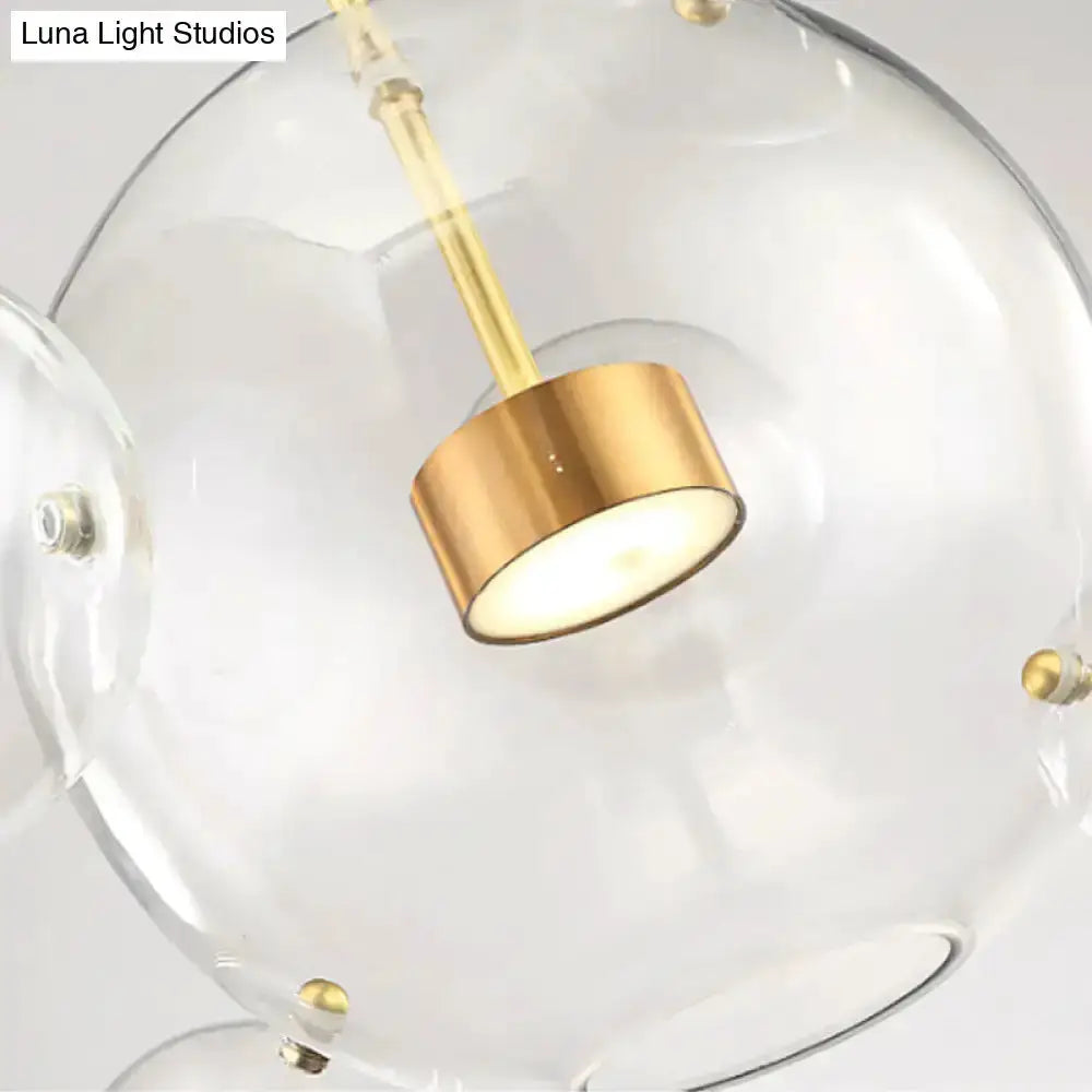 Modern brass bubble cluster pendant light with clear glass globes for dining room Decorbites on Tampa Home & Garden Store