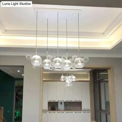 Modern brass bubble cluster pendant light set with clear glass spheres by Decorbites on Tampa Home & Garden Store