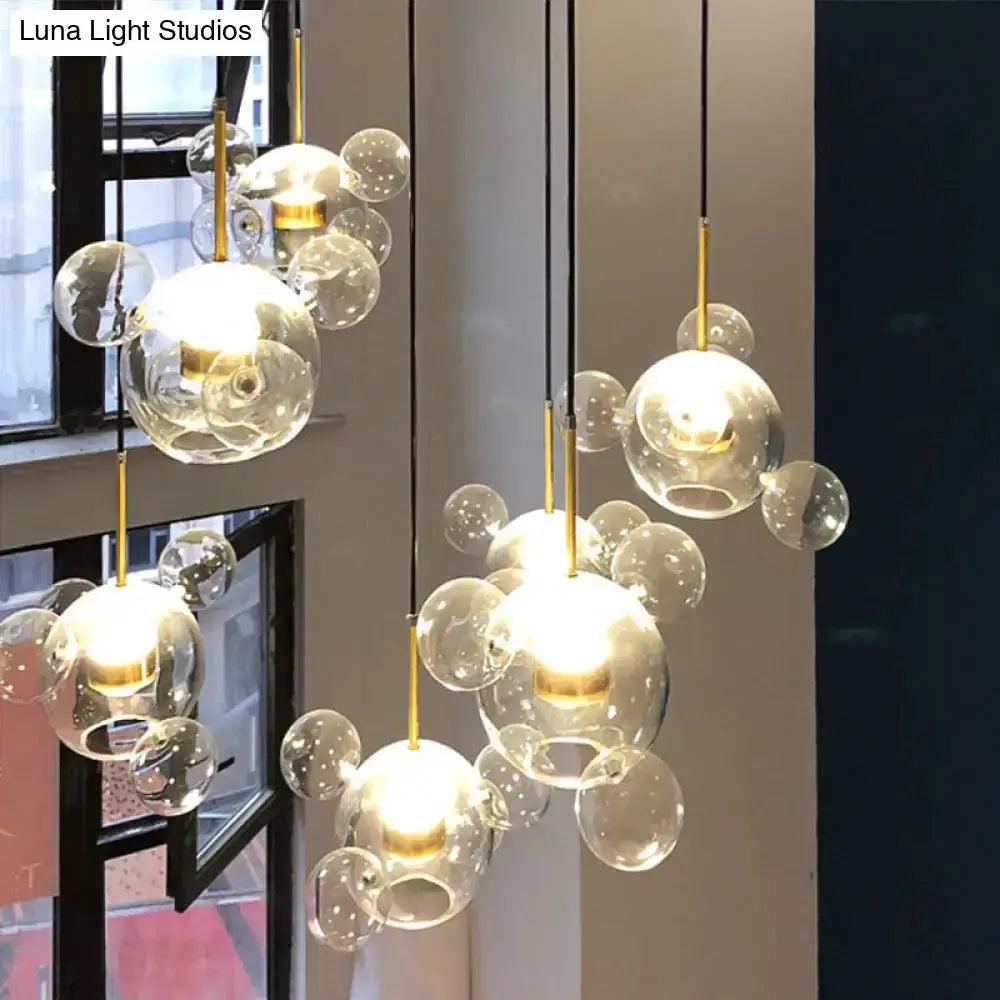 Modern brass bubble cluster pendant lights with clear glass spheres, 3 lights by Decorbites on Tampa Home & Garden Store