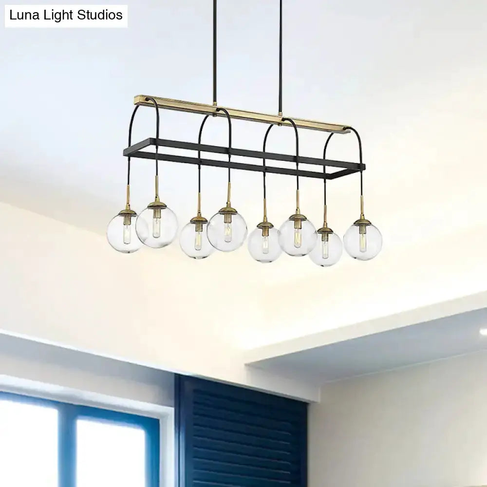 Minimalist arch pendant light black frame with brass accents and 8 clear glass globes on Tampa Home & Garden Store