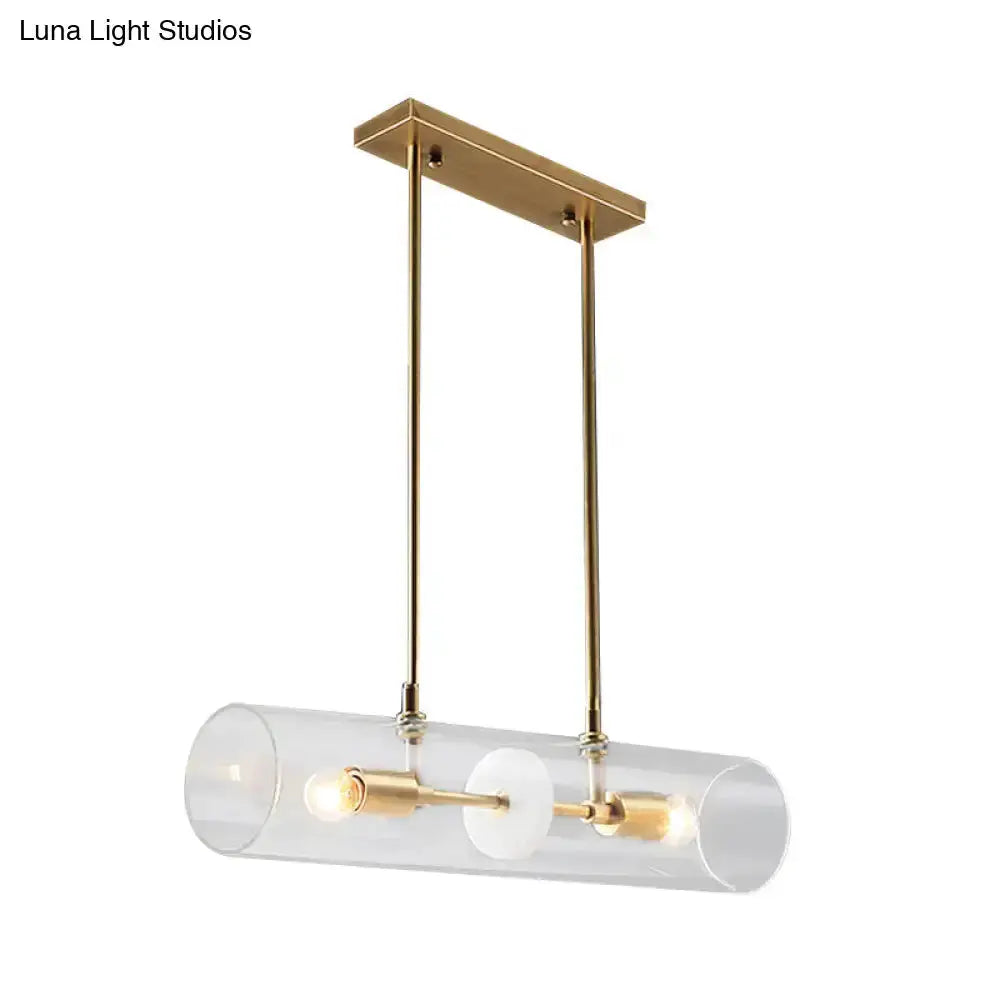 Island pendant in brass finish with clear glass cylinder and dual bulbs Decorbites on Tampa Home & Garden Store