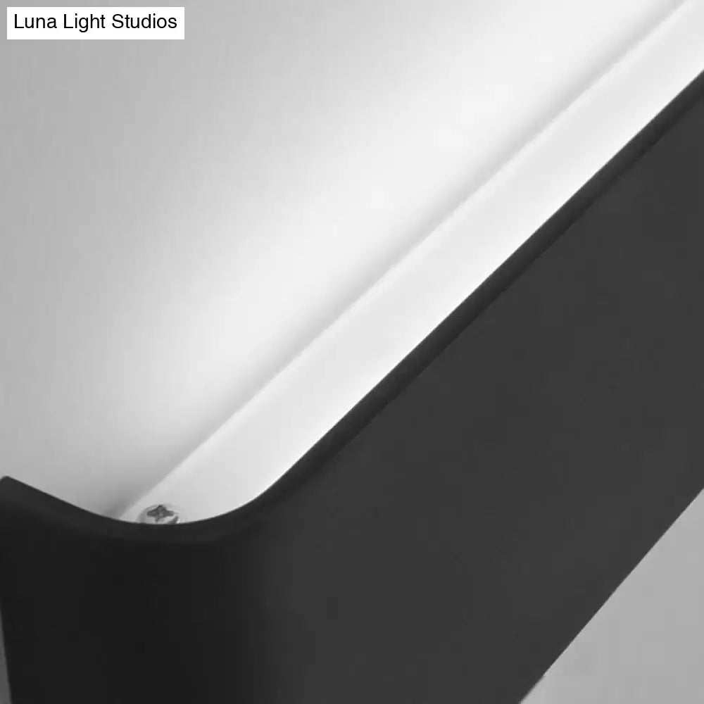 Black metal wall lamp with angular arm on Tampa Home & Garden Store