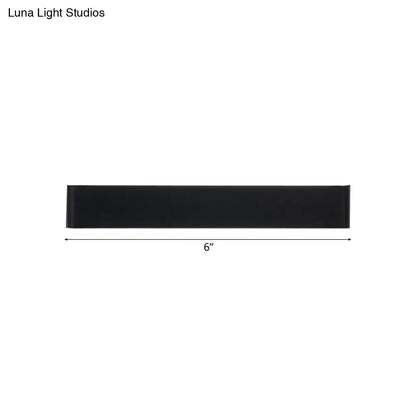 Black metal wall lamp with slim 6-inch bar design for modern decor on Tampa Home & Garden Store