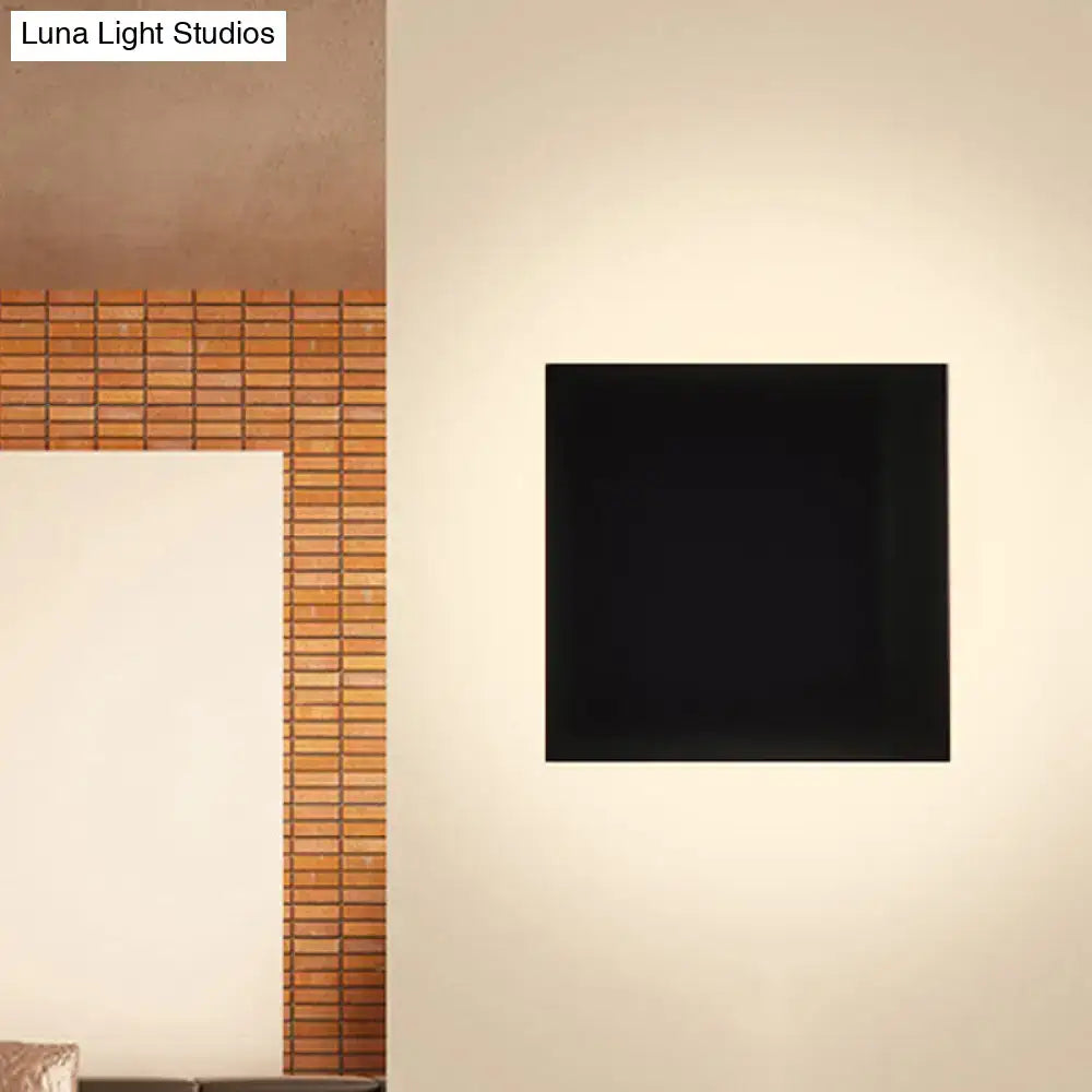 Black Square Soft-Glow Wall Sconce square black fixture with soft glow on beige wall Decorbites on Tampa Home & Garden Store