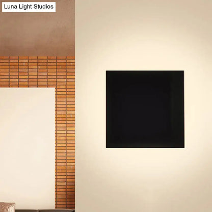 Black Square Soft-Glow Wall Sconce square black fixture with soft glow on beige wall Decorbites on Tampa Home & Garden Store