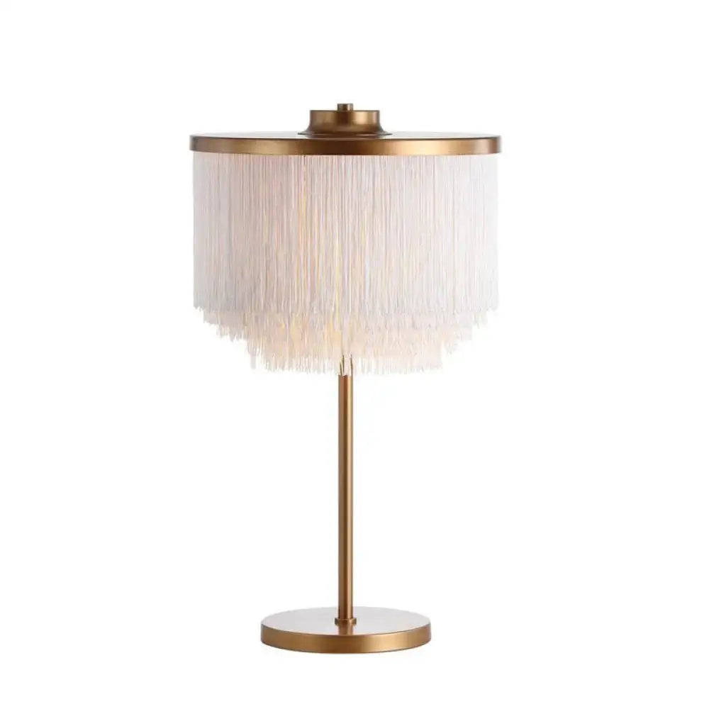 Brass tassel fringe lamp by Decorbites with white fringe shade on gold stem on Tampa Home & Garden Store