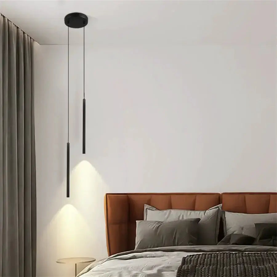 Modern black 2cm LED pendant lights, two slim pendants over a bed with an orange headboard on Tampa Home & Garden Store